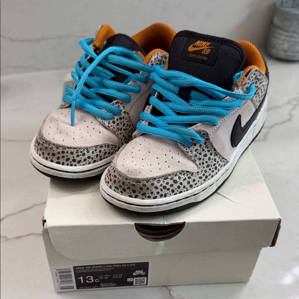 Nike Kids SB Dunk Low — White, Black, Blue Laces, Orange Lining